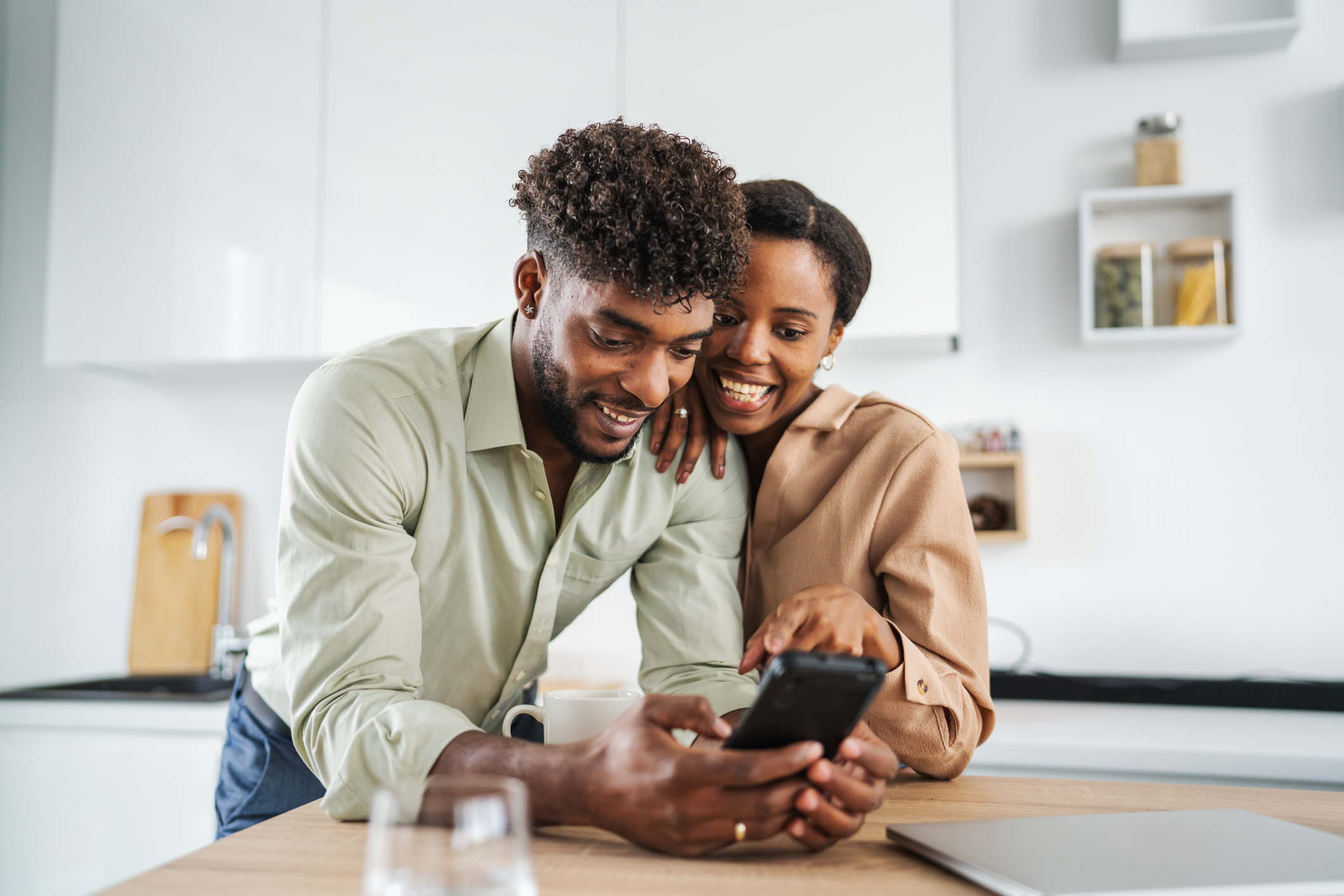 A couple exploring their next move together on a phone